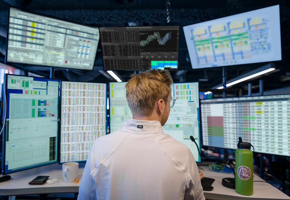 Solo trader working at multiple screens